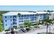 Light blue condo building, three stories high with parking at 8413 Placida Rd # 407, Placida, FL 33946