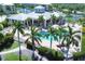 Resort-style pool with lounge chairs surrounded by palm trees at 8413 Placida Rd # 407, Placida, FL 33946