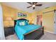 Bright bedroom with king-size bed, ceiling fan and en-suite bathroom access at 8413 Placida Rd # 407, Placida, FL 33946