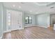 Bright living room with wood-look floors and entryway at 8374 Agate St, Port Charlotte, FL 33981
