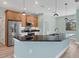 Open concept kitchen with stainless steel appliances and a breakfast bar at 8374 Agate St, Port Charlotte, FL 33981
