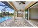 Enclosed patio with pool access, tile flooring, and sliding doors at 8374 Agate St, Port Charlotte, FL 33981