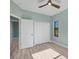 Bedroom with light walls, wood-look flooring, and a large closet at 8374 Agate St, Port Charlotte, FL 33981