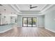 Bright living room with sliding glass doors opening to a pool and screened patio at 8374 Agate St, Port Charlotte, FL 33981