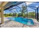 Relaxing screened-in pool area with tiled deck at 8374 Agate St, Port Charlotte, FL 33981