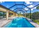 Large screened-in pool and spa with spacious deck at 8374 Agate St, Port Charlotte, FL 33981