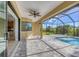 Covered patio with pool access and sliding glass doors at 8374 Agate St, Port Charlotte, FL 33981
