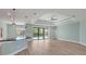 Open floor plan living room with kitchen island and pool view at 8374 Agate St, Port Charlotte, FL 33981