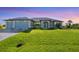 Two-car garage and well-manicured lawn at 8374 Agate St, Port Charlotte, FL 33981
