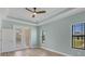 Spacious bedroom with double doors leading to the patio at 8374 Agate St, Port Charlotte, FL 33981