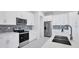 Modern kitchen with stainless steel appliances and white shaker cabinets at 15715 Viscount Cir, Port Charlotte, FL 33981