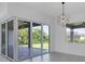 Bright dining room with sliding glass doors leading to the backyard at 15715 Viscount Cir, Port Charlotte, FL 33981