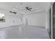 Spacious living area with light flooring and access to outdoor space at 15715 Viscount Cir, Port Charlotte, FL 33981