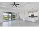 Open concept kitchen with white cabinets, island, and stainless steel appliances at 15715 Viscount Cir, Port Charlotte, FL 33981