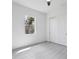 Simple bedroom with double door closet and a window at 15715 Viscount Cir, Port Charlotte, FL 33981