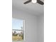 Simple bedroom with window and ceiling fan at 15715 Viscount Cir, Port Charlotte, FL 33981