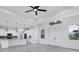 Modern kitchen with white cabinets, stainless steel appliances, and a large island at 15715 Viscount Cir, Port Charlotte, FL 33981