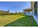 View of the backyard from the side of the house at 15715 Viscount Cir, Port Charlotte, FL 33981