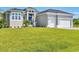 Single-story home with a two-car garage at 15715 Viscount Cir, Port Charlotte, FL 33981