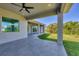 Covered patio with ceiling fan, offering relaxing outdoor space at 15715 Viscount Cir, Port Charlotte, FL 33981