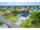 Aerial view of a house and neighborhood at 15715 Viscount Cir, Port Charlotte, FL 33981
