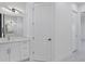 Bright bathroom with white cabinets and a quartz countertop at 15715 Viscount Cir, Port Charlotte, FL 33981
