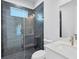 Clean bathroom with a walk-in shower and pebble floor at 15715 Viscount Cir, Port Charlotte, FL 33981