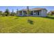 House backyard view, showing a well-maintained lawn at 15715 Viscount Cir, Port Charlotte, FL 33981