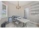 Bright breakfast nook with window and chandelier, perfect for casual dining at 249 Rotonda Cir, Rotonda West, FL 33947