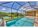 Relax in this screened pool and spa area, complete with tranquil water views at 249 Rotonda Cir, Rotonda West, FL 33947
