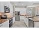 Modern kitchen featuring stainless steel appliances and granite countertops at 249 Rotonda Cir, Rotonda West, FL 33947