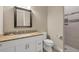 Bathroom with granite vanity, toilet and walk in shower at 249 Rotonda Cir, Rotonda West, FL 33947