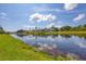 Serene waterfront view featuring a peaceful canal and lush greenery at 249 Rotonda Cir, Rotonda West, FL 33947