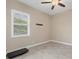 Versatile bonus room with large window and neutral color palette at 249 Rotonda Cir, Rotonda West, FL 33947