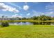 Scenic waterfront property with lush landscaping and tranquil water views at 249 Rotonda Cir, Rotonda West, FL 33947