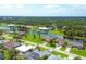 Waterfront community with various home styles and lush landscaping at 249 Rotonda Cir, Rotonda West, FL 33947