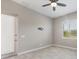 Spacious bedroom with window shutters, ceiling fan and door to outside at 249 Rotonda Cir, Rotonda West, FL 33947