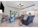 Open living room with view into the kitchen and pool at 249 Rotonda Cir, Rotonda West, FL 33947