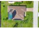 Aerial view of house with pool and solar panels at 249 Rotonda Cir, Rotonda West, FL 33947