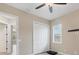 Bright bedroom with window shutters, ceiling fan, and spacious closet at 249 Rotonda Cir, Rotonda West, FL 33947