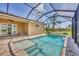 Inviting pool and spa with screened enclosure and beautiful water views at 249 Rotonda Cir, Rotonda West, FL 33947