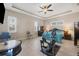 Large bedroom with ceiling fan, ample space, and room for exercise equipment at 249 Rotonda Cir, Rotonda West, FL 33947