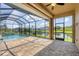 Enjoy the refreshing pool with a screened enclosure offering privacy and stunning views at 249 Rotonda Cir, Rotonda West, FL 33947