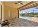 Relaxing pool and spa with screened enclosure, offering picturesque water views at 249 Rotonda Cir, Rotonda West, FL 33947