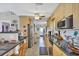 Modern kitchen featuring granite countertops and ample cabinet space at 7168 Lighthouse St, Englewood, FL 34224