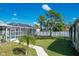 Landscaped backyard with a spacious pool and RV parking at 7168 Lighthouse St, Englewood, FL 34224