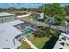 Aerial view of house, pool, and large backyard with surrounding neighborhood at 7168 Lighthouse St, Englewood, FL 34224