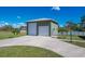 Attached two-car garage with modern doors and extra space at 7168 Lighthouse St, Englewood, FL 34224