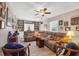 Spacious living room with a comfortable sectional sofa and ample built-in shelving at 7168 Lighthouse St, Englewood, FL 34224