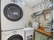 Convenient laundry room with washer, dryer, and ample storage at 7168 Lighthouse St, Englewood, FL 34224